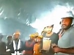 This picture released by Department of Information and Public Relation (DIPR) Uttarakhand and taken with endoscopic camera on November 21, 2023 shows a group of workers trapped inside the under-construction tunnel, days after it collapsed in the Uttarkashi district of India's Uttarakhand state. This picture released by Department of Information and Public Relation (DIPR) Uttarakhand and taken with endoscopic camera on November 21, 2023 shows a group of workers trapped inside the under-construction tunnel, days after it collapsed in the Uttarkashi district of India's Uttarakhand state.