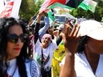 Supporters of South Africa's ruling African National Congress (ANC) and various political parties including civil society groups gather in solidarity with the Palestinian people outside the Israeli embassy in Pretoria.