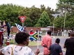 Members of the Active African Christians United Movements (AACUM) stand on and wave South African and Israeli flags as others gather in support of Israel outside of the embassy of Israel in Pretoria. Members of the Active African Christians United Movements (AACUM) stand on and wave South African and Israeli flags as others gather in support of Israel outside of the embassy of Israel in Pretoria.