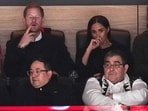 Prince Harry, top left, and Meghan Markle, top right, The Duke and Duchess of Sussex, watch the Vancouver Canucks and the San Jose Sharks play during the first period of an NHL hockey game in Vancouver, British Columbia, Monday, Nov. 20, 2023. (Darryl Dyck/The Canadian Press via AP)