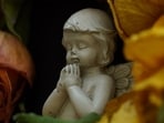 Representative image of a little angel praying. Representative image of a little angel praying.