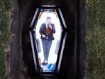 MrBeast inside a transparent coffin. MrBeast inside a transparent coffin.