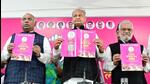Congress President Mallikarjun Kharge, Rajasthan chief minister Ashok Gehlot and party leader CP Joshi release the party’s manifesto for the upcoming state assembly elections in Jaipur on Tuesday. (ANp)