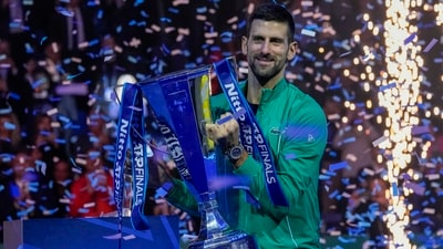 Serbia's Novak Djokovic celebrates with the trophy after winning the singles final of the ATP World Tour Finals. (AP) Serbia's Novak Djokovic celebrates with the trophy after winning the singles final of the ATP World Tour Finals. (AP)
