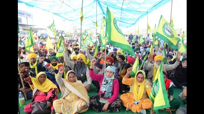 Farmer organisations supporters stage a sit-in protest over sugarcane prices, at Jalandhar-Phagwara highway in Jalandhar on Tuesday. (ANI)