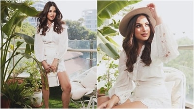 Harnaaz wore a coordinated white blouse and shorts in the photoshoot. The shirt features a raised neckline, front button closures, billowy full-length sleeves with cinched cuffs, a relaxed silhouette, an intricate cut-out design, floral threadwork, and a semi-sheer silhouette. Meanwhile, the shorts have a high-rise waist, scalloped hem, snug-fitting, and applique work on the borders.&nbsp; (Instagram)
