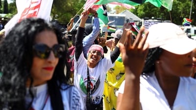 Supporters of South Africa's ruling African National Congress (ANC) and various political parties including civil society groups gather in solidarity with the Palestinian people outside the Israeli embassy in Pretoria. (REUTERS)