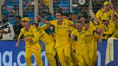 Pat Cummins and teammates run to celebrate after their win in the ICC Men's Cricket World Cup final match against India (AP) Pat Cummins and teammates run to celebrate after their win in the ICC Men's Cricket World Cup final match against India (AP)