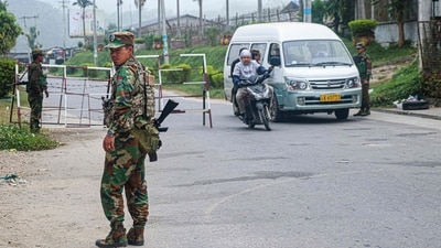 This photo taken on November 10, 2023 shows fighters of the ethnic rebel group Ta'ang National Liberation Army (TNLA) standing guard at a check point in the town of Namhkam in northern Shan state. (AFP) This photo taken on November 10, 2023 shows fighters of the ethnic rebel group Ta'ang National Liberation Army (TNLA) standing guard at a check point in the town of Namhkam in northern Shan state. (AFP)