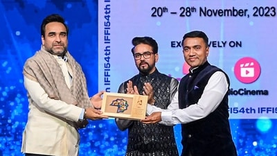 Union Minister for Information & Broadcasting and Youth Affairs & Sports Anurag Singh Thakur and Goa Chief Minister Pramod Sawant feliciate actor Pankaj Tripathi during the inaugural ceremony of IFFI. The actor was recently seen alongside Akshay Kumar in OMG 2. (PTI) Union Minister for Information & Broadcasting and Youth Affairs & Sports Anurag Singh Thakur and Goa Chief Minister Pramod Sawant feliciate actor Pankaj Tripathi during the inaugural ceremony of IFFI. The actor was recently seen alongside Akshay Kumar in OMG 2. (PTI)