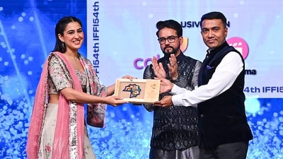 Union Minister for Information & Broadcasting and Youth Affairs & Sports Anurag Singh Thakur and Goa Chief Minister Pramod Sawant felicitate actor Sara Ali Khan during the inaugural ceremony of 54Th International Film Festival of India (IFFI). Sara, who was last seen in Zara Hatke Zara Bachke, wore a pink and white ethnic look. (PTI) Union Minister for Information & Broadcasting and Youth Affairs & Sports Anurag Singh Thakur and Goa Chief Minister Pramod Sawant felicitate actor Sara Ali Khan during the inaugural ceremony of 54Th International Film Festival of India (IFFI). Sara, who was last seen in Zara Hatke Zara Bachke, wore a pink and white ethnic look. (PTI)
