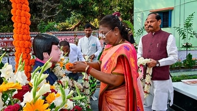 President Droupadi Murmu garlands the statue at the Samadhi Sthal in the premises SLS Memorial School at Pahadpur, in Mayurbhanj district. (PTI) President Droupadi Murmu garlands the statue at the Samadhi Sthal in the premises SLS Memorial School at Pahadpur, in Mayurbhanj district. (PTI)