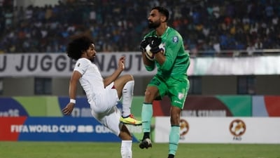Amrinder Singh in action with Qatar's Akram Afif&nbsp; (REUTERS)