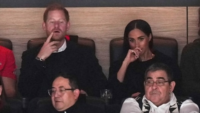 Prince Harry, top left, and Meghan Markle, top right, The Duke and Duchess of Sussex, watch the Vancouver Canucks and the San Jose Sharks play during the first period of an NHL hockey game in Vancouver, British Columbia, Monday, Nov. 20, 2023. (Darryl Dyck/The Canadian Press via AP) (AP) Prince Harry, top left, and Meghan Markle, top right, The Duke and Duchess of Sussex, watch the Vancouver Canucks and the San Jose Sharks play during the first period of an NHL hockey game in Vancouver, British Columbia, Monday, Nov. 20, 2023. (Darryl Dyck/The Canadian Press via AP) (AP)