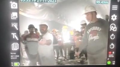 Rescue workers try to make contact with the trapped workers through walkie-talkie.