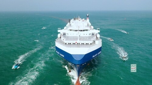 The Galaxy Leader cargo ship is escorted by Houthi boats in the Red Sea in this photo released November 20. (REUTERS)