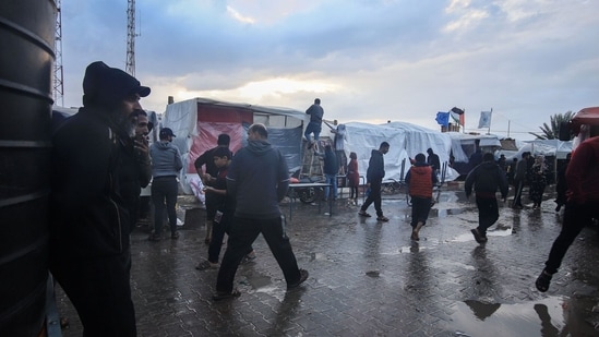 Israel-Hamas War: Displaced Palestinians in a camp, operated by the United Nations Relief and Works Agency (UNWRA), in Khan Younis, Gaza. (Bloomberg)