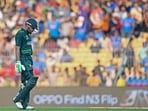 Babar Azam walks back to the pavilion after his dismissal during the 2023 ICC Men's Cricket World Cup one-day international (ODI) match between Pakistan and Afghanistan.