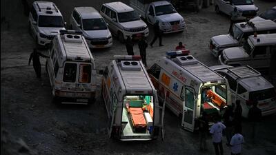 Ambulances on standby as rescue operation enters its final phase, for workers trapped in the Silkyara tunnel, days after it collapsed in the Uttarkashi district of Uttarakhand on Wednesday. (AFP) Ambulances on standby as rescue operation enters its final phase, for workers trapped in the Silkyara tunnel, days after it collapsed in the Uttarkashi district of Uttarakhand on Wednesday. (AFP)
