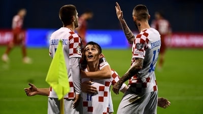 Croatia's forward #17 Ante Budimir (C) celebrates after opening the scoring during the UEFA Euro 2024 Group D qualification football match between Croatia and Armenia at the Maksimir Stadium in Zagreb (AFP)