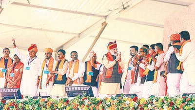 Prime Minister Narendra Modi greets BJP leaders in Sagwada, Rajasthan, on Wednesday. (PTI) Prime Minister Narendra Modi greets BJP leaders in Sagwada, Rajasthan, on Wednesday. (PTI)