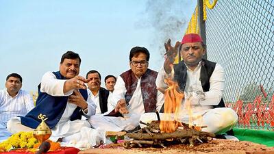 Samajwadi Party president Akhilesh Yadav with party leaders Ram Gopal Yadav and Shivpal Singh Yadav in Etawah on Wednesday. (PTI)