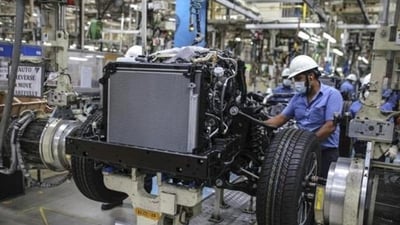 Workers labour at a chassis assembly line on the Innova Crysta compact multi-purpose vehicle (MPV) production line at the Toyota Kirloskar Motor Ltd. plant in Bidadi, Karnataka. (Bloomberg File Photo) Workers labour at a chassis assembly line on the Innova Crysta compact multi-purpose vehicle (MPV) production line at the Toyota Kirloskar Motor Ltd. plant in Bidadi, Karnataka. (Bloomberg File Photo)