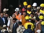 Uttarakhand chief minister Pushkar Singh Dhami (C), alongside Independent disaster investigator and President of the International Tunnelling and Underground Space Association Arnold Dix (9L), walk out of the tunnel after reviewing the rescue operation to free workers trapped in the Silkyara under construction road tunnel. Uttarakhand chief minister Pushkar Singh Dhami (C), alongside Independent disaster investigator and President of the International Tunnelling and Underground Space Association Arnold Dix (9L), walk out of the tunnel after reviewing the rescue operation to free workers trapped in the Silkyara under construction road tunnel.