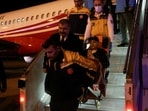 Medical staff carry a Palestinian cancer patient who was evacuated from Gaza to Egypt and brought to Turkey by plane.