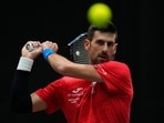 Serbia's Novak Djokovic practices during a training session of the Davis Cup in Malaga, Spain Serbia's Novak Djokovic practices during a training session of the Davis Cup in Malaga, Spain