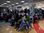 Children and their parents wait at an outpatient area at a children's hospital in Beijing. Children and their parents wait at an outpatient area at a children's hospital in Beijing.
