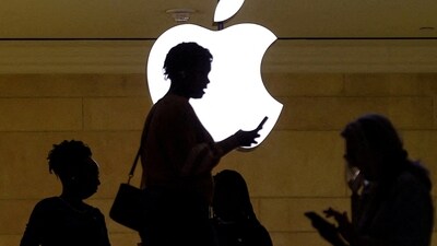 A women uses an iPhone mobile device. (REUTERS)