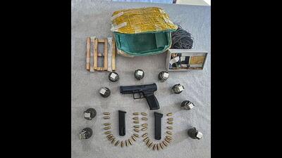 Arms, ammunition and explosives recovered by security forces during a joint search operation by the police and the army along the Line of Control in the Palanwalla sector of Akhnoor sub division of Jammu district on Thursday. (PTI Photo)