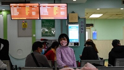 Children and their parents wait at an outpatient area at a children hospital in Beijing amid pneumonia outbreak. (AFP) Children and their parents wait at an outpatient area at a children hospital in Beijing amid pneumonia outbreak. (AFP)