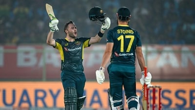 Australia's Josh Inglis celebrates after scoring a century (100 runs) as his teammate Marcus Stoinis (R) watches (AFP) Australia's Josh Inglis celebrates after scoring a century (100 runs) as his teammate Marcus Stoinis (R) watches (AFP)