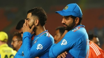 India's Virat Kohli and Rohit Sharma look dejected after losing the ICC Cricket World Cup final (REUTERS)