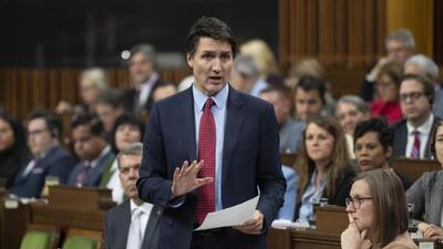 Canada Prime Minister Justin Trudeau reads a statement about the situation at the border during Question Period, Wednesday, Nov. 22, 2023, in in Ottawa, Ontario. (AP) Canada Prime Minister Justin Trudeau reads a statement about the situation at the border during Question Period, Wednesday, Nov. 22, 2023, in in Ottawa, Ontario. (AP)