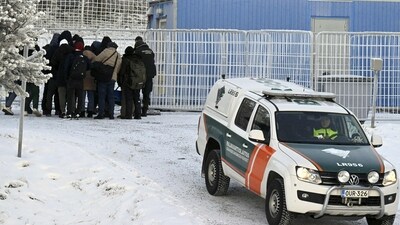 Migrants and a vehicle of the Finnish Border Guard are seen at the international border crossing at Salla, northern Finland, on November 23, 2023. Russia announced tightened security in its northern Murmansk region after Finland said it would close all but one border crossing between the two countries. Helsinki said on November 22, 2023 the move follows a surge in attempted crossings by migrants seeking asylum in the EU country -- which Finland says is a destabilisation ploy by Russia. (AFP) Migrants and a vehicle of the Finnish Border Guard are seen at the international border crossing at Salla, northern Finland, on November 23, 2023. Russia announced tightened security in its northern Murmansk region after Finland said it would close all but one border crossing between the two countries. Helsinki said on November 22, 2023 the move follows a surge in attempted crossings by migrants seeking asylum in the EU country -- which Finland says is a destabilisation ploy by Russia. (AFP)