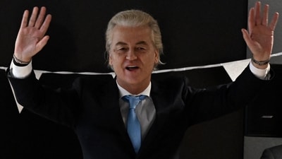 Leader of the Party for Freedom (PVV) Geert Wilders waves as he arrives at a post-election meeting at the Nieuwspoort conference center in The Hague on November 23, 2023. (AFP) Leader of the Party for Freedom (PVV) Geert Wilders waves as he arrives at a post-election meeting at the Nieuwspoort conference center in The Hague on November 23, 2023. (AFP)