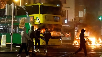 A bus burns during a demonstration following a suspected stabbing that left few children injured in Dublin, Ireland. (REUTERS)