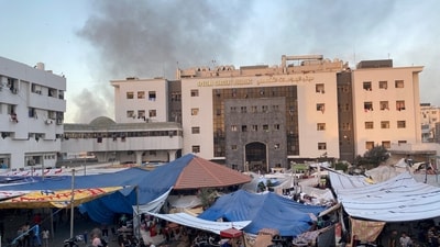 FILE PHOTO: Smoke rises as displaced Palestinians take shelter at Al Shifa hospital, amid the ongoing conflict between Hamas and Israel, in Gaza City, November 8, 2023. REUTERS/Doaa Rouqa/File Photo (REUTERS)
