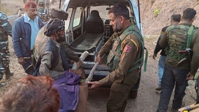 Army and police personnel shift bodies of two terrorists killed during an encounter at Bajimaal area, in Rajouri district on Thursday. (PTI)