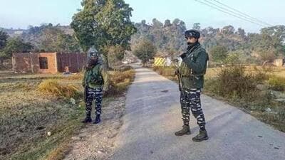 Security personnel standing guard during an encounter with terrorists in the Baji Maal area of Rajouri district on Thursday (PTI)
