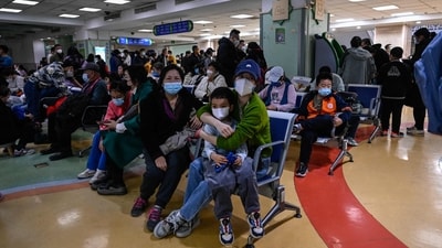 Children and their parents wait at an outpatient area at a children's hospital in Beijing. (AFP) Children and their parents wait at an outpatient area at a children's hospital in Beijing. (AFP)