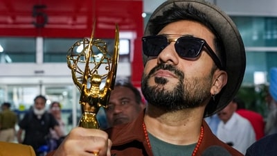 Vir Das poses with his Emmy award. (PTI) Vir Das poses with his Emmy award. (PTI)