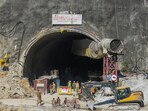 Security personnel and others at the under-construction Silkyara tunnel as drilling through the rubble to prepare an escape route for the 41 trapped workers remains stalled in Uttarkashi district on November 24. 