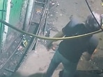 A CCTV video grab shows the murderer standing over the victim in the narrow bylane at north-east Delhi’s Welcome. (Video grab)