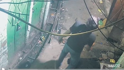 A CCTV video grab shows the murderer standing over the victim in the narrow bylane at north-east Delhi’s Welcome. (Video grab)