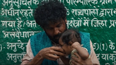 Manoj Bajpayee as Dasru holding his three-month-old baby in still from Joram trailer. Manoj Bajpayee as Dasru holding his three-month-old baby in still from Joram trailer.