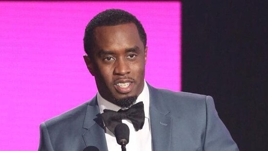 Sean Diddy Combs presents the award for best collaboration of the year at the American Music Awards in Los Angeles. (Matt Sayles/Invision/AP)